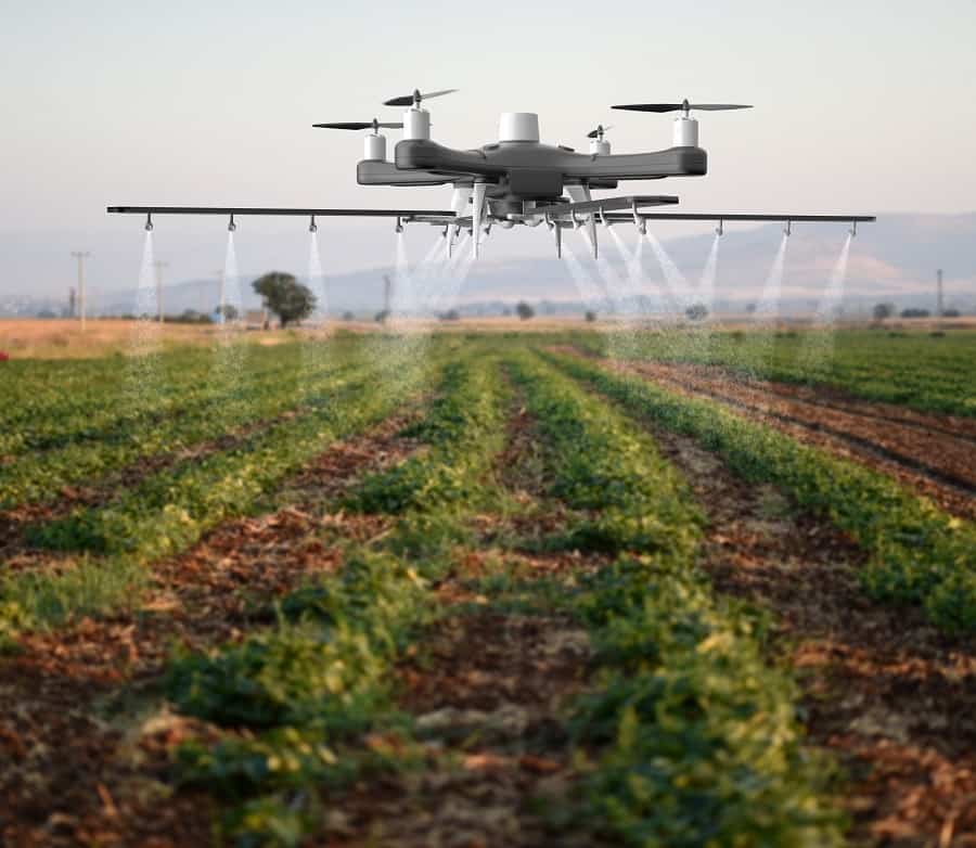 Drone spraying a field